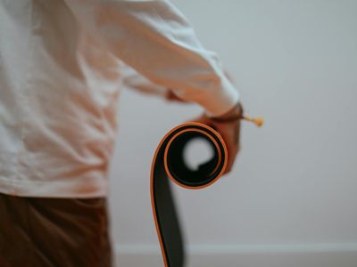 Yoga mat rolled up next to a window with soft morning light.
